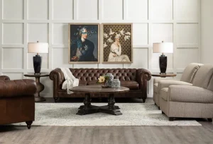 A living room with big nicely hanging frames on the middle