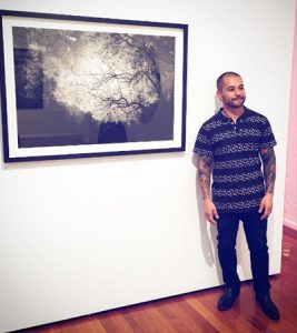 A man standing on a newly installed frame on the wall