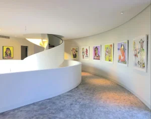 A hallway with picture frames hanging on the wall